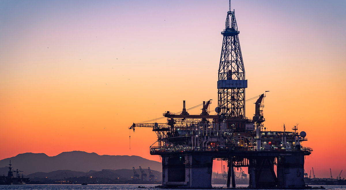 Offshore oil rig at sunset
