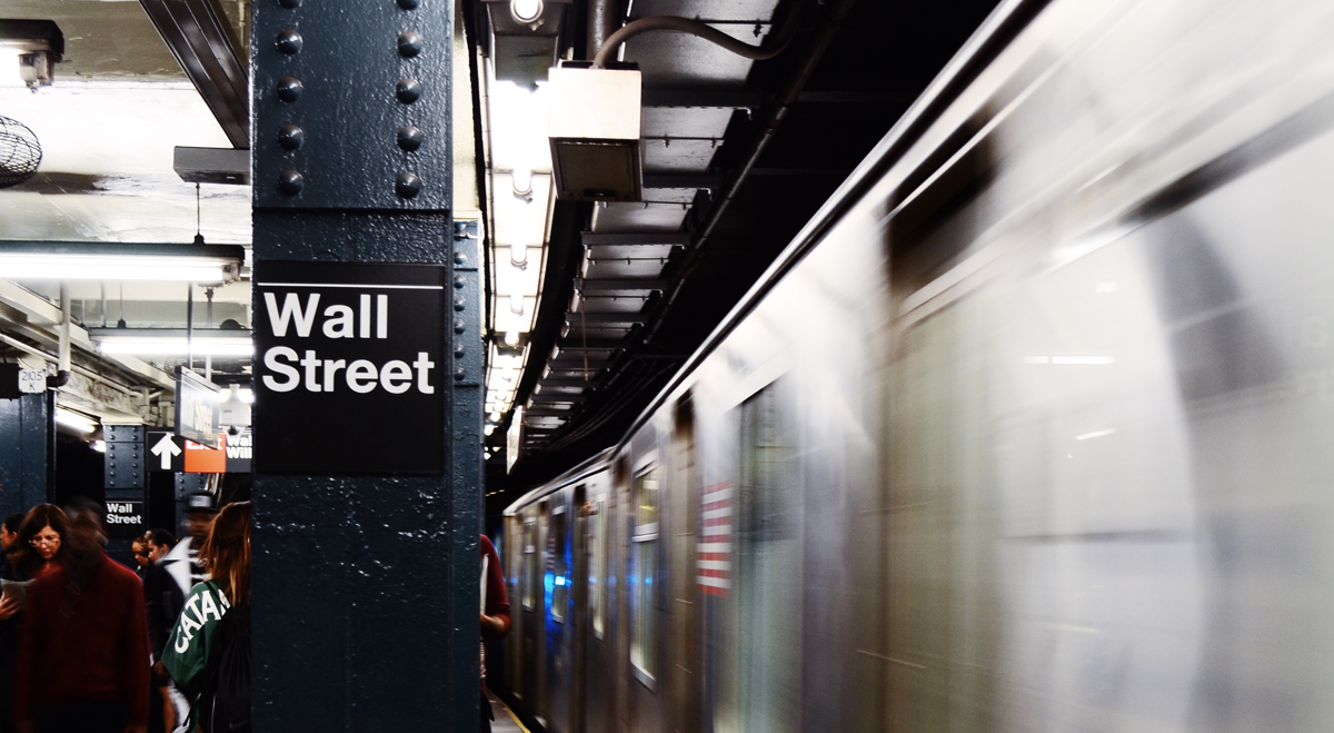 Wall Street subway station sign